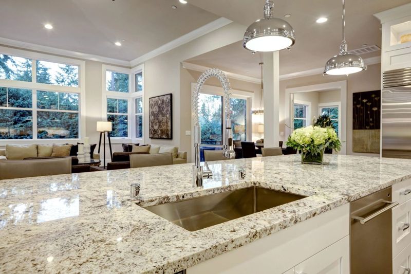 Kitchen with granite countertops and white cabinets